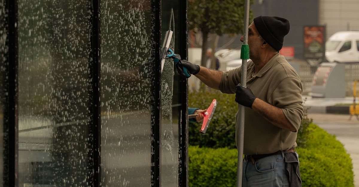 Professional cleaning an exterior window